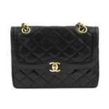 CHANEL - a black small Paris Double Flap handbag.