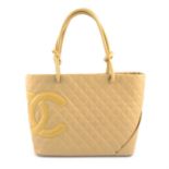 CHANEL - a beige CC Cambon leather tote bag.