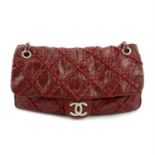 -CHANEL - a 2009 Bordeaux Jumbo ultra stitch flap bag.