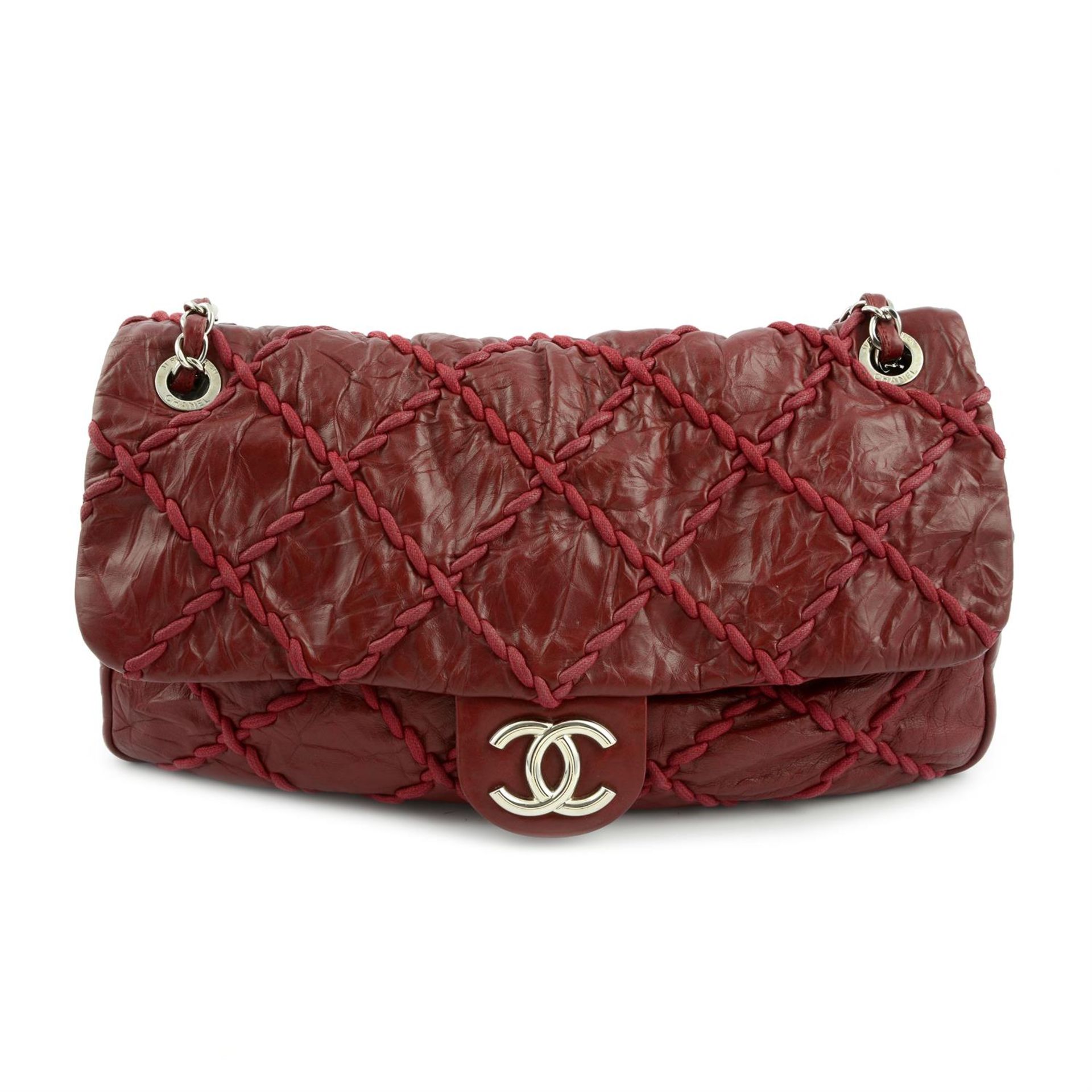 -CHANEL - a 2009 Bordeaux Jumbo ultra stitch flap bag.