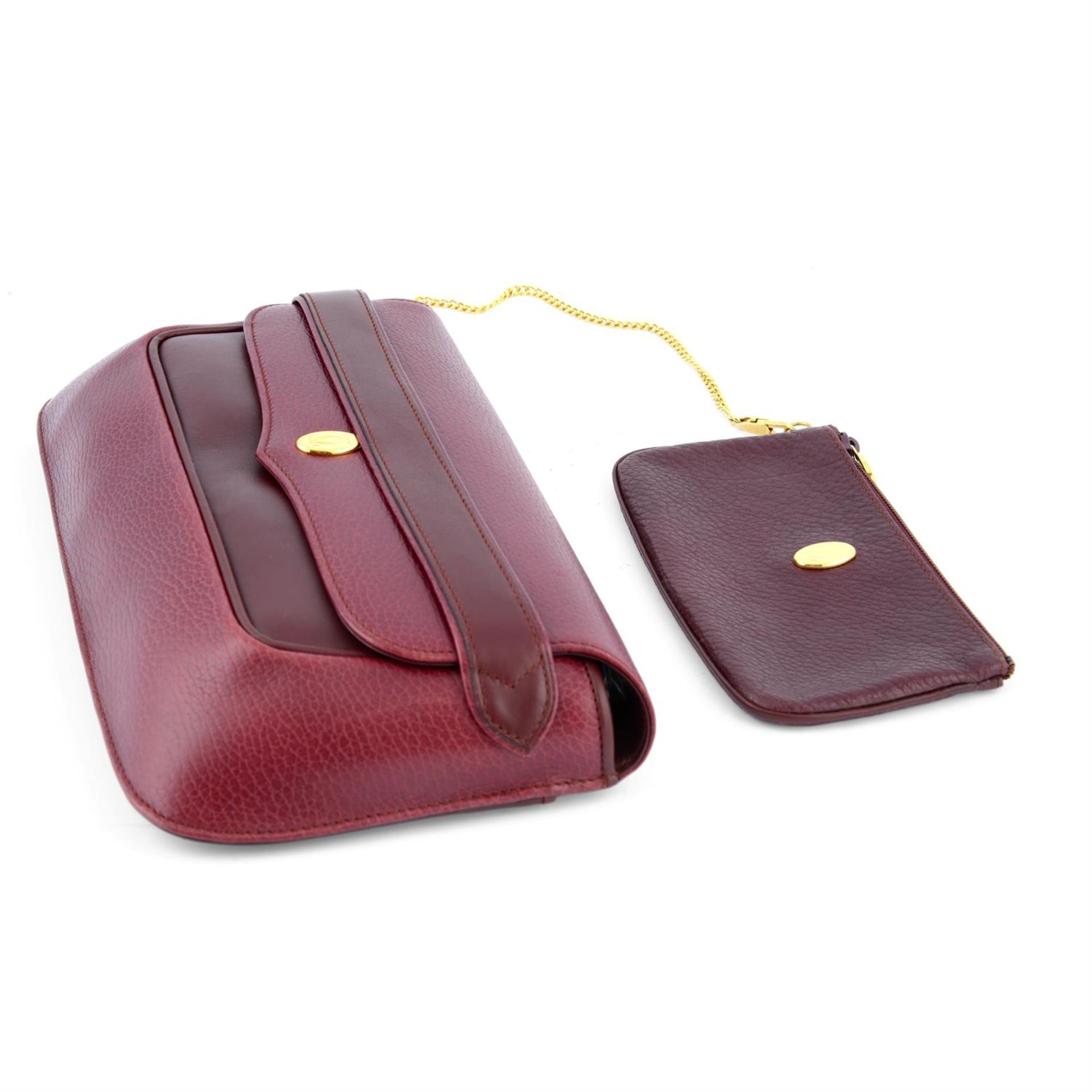 CARTIER - a 1989 red leather clutch. - Image 3 of 4