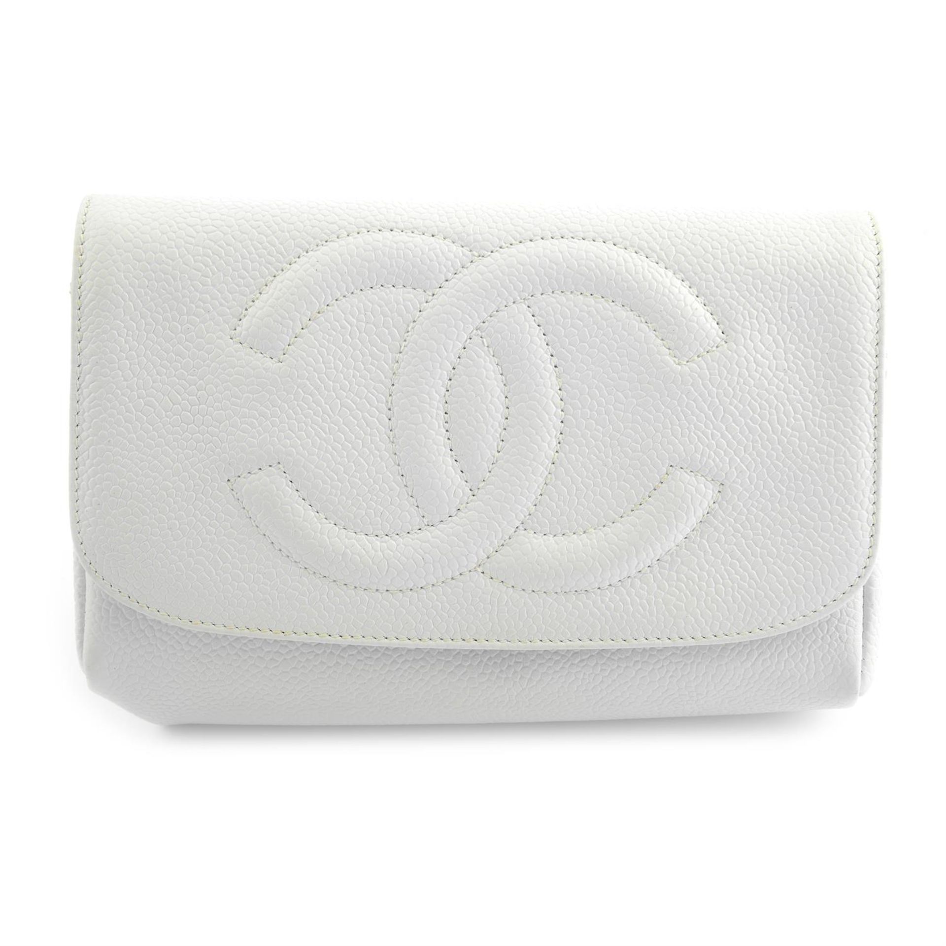 CHANEL - a 1996 white caviar leather cosmetic pouch.