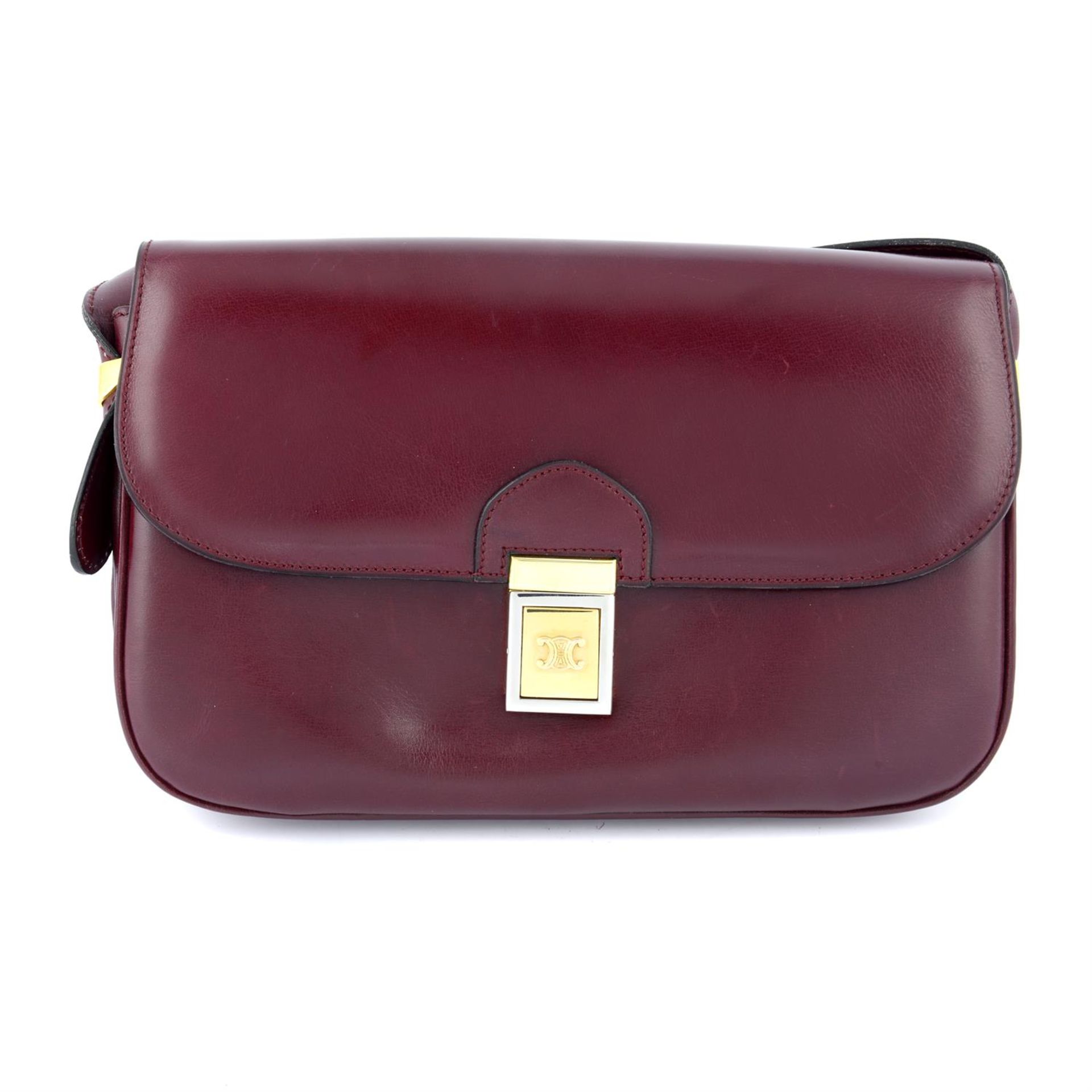 CÉLINE - a red leather shoulder bag.