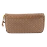 BOTTEGA VENETA - a Intrecciato leather Zippy wallet.