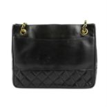 CHANEL - a 1990 black quilted tote bag.