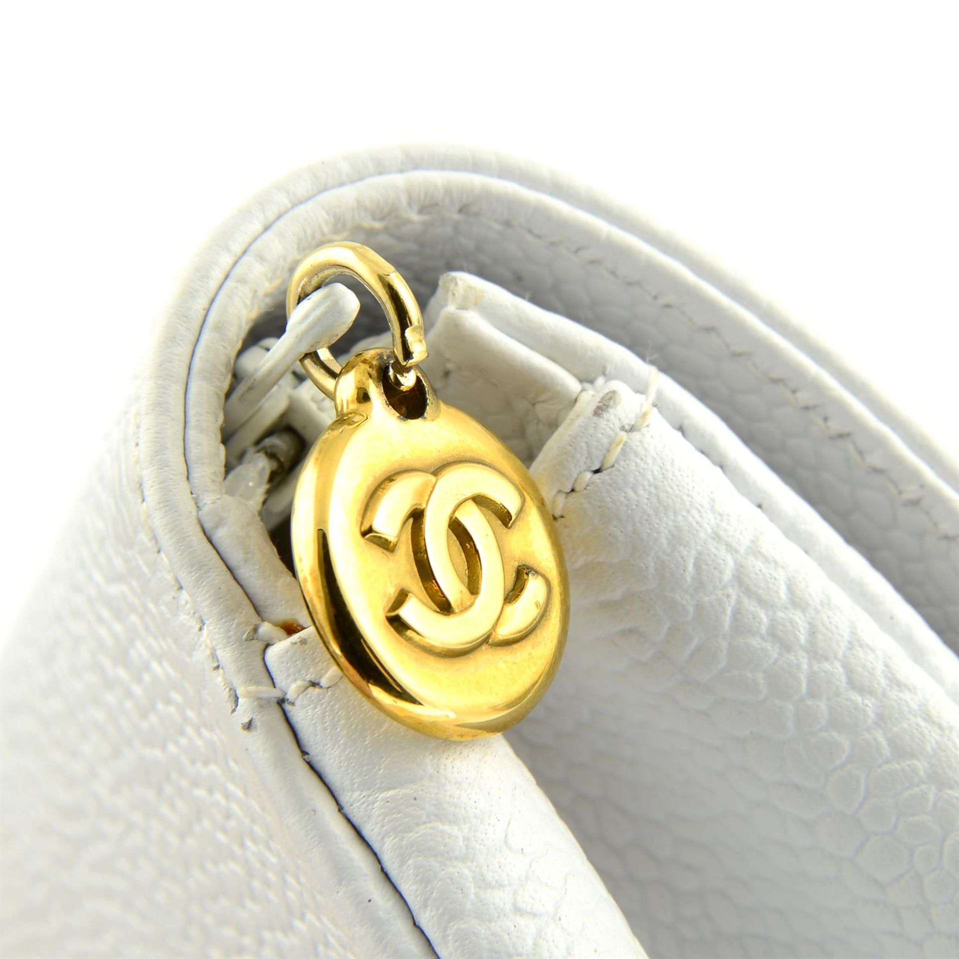CHANEL - a 1996 white caviar leather cosmetic pouch. - Image 3 of 4