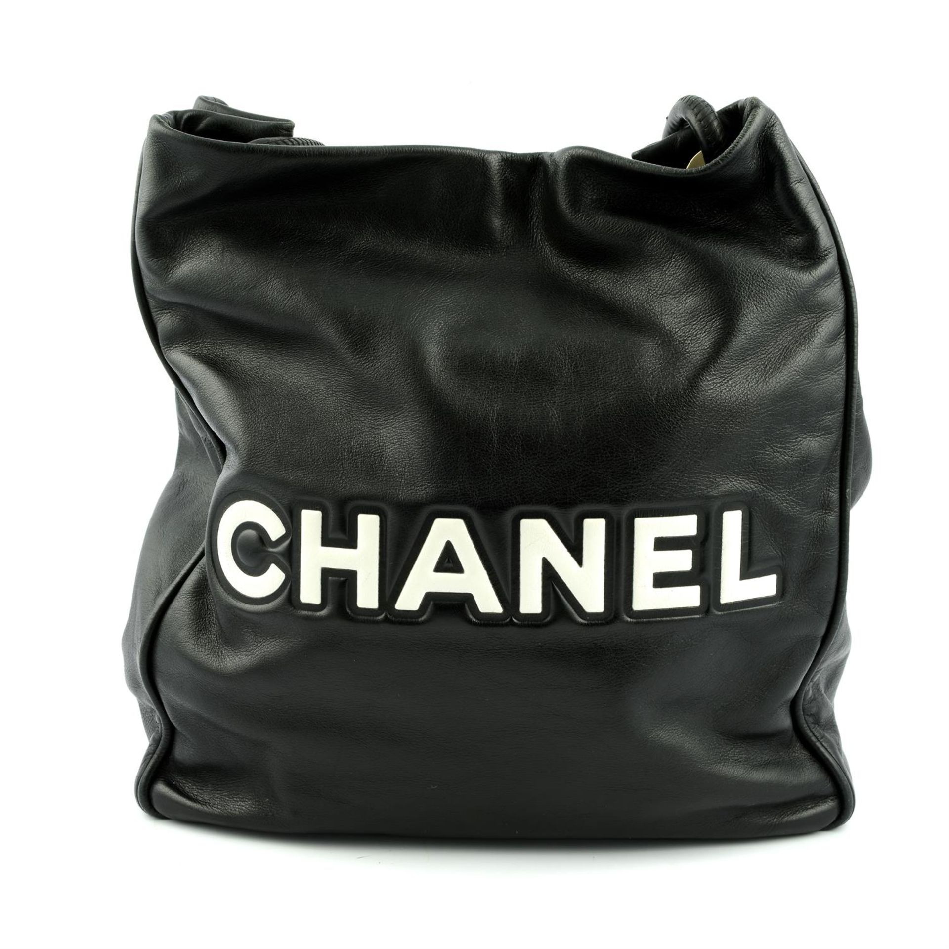 CHANEL - a black leather Camellia tote bag. - Image 2 of 5