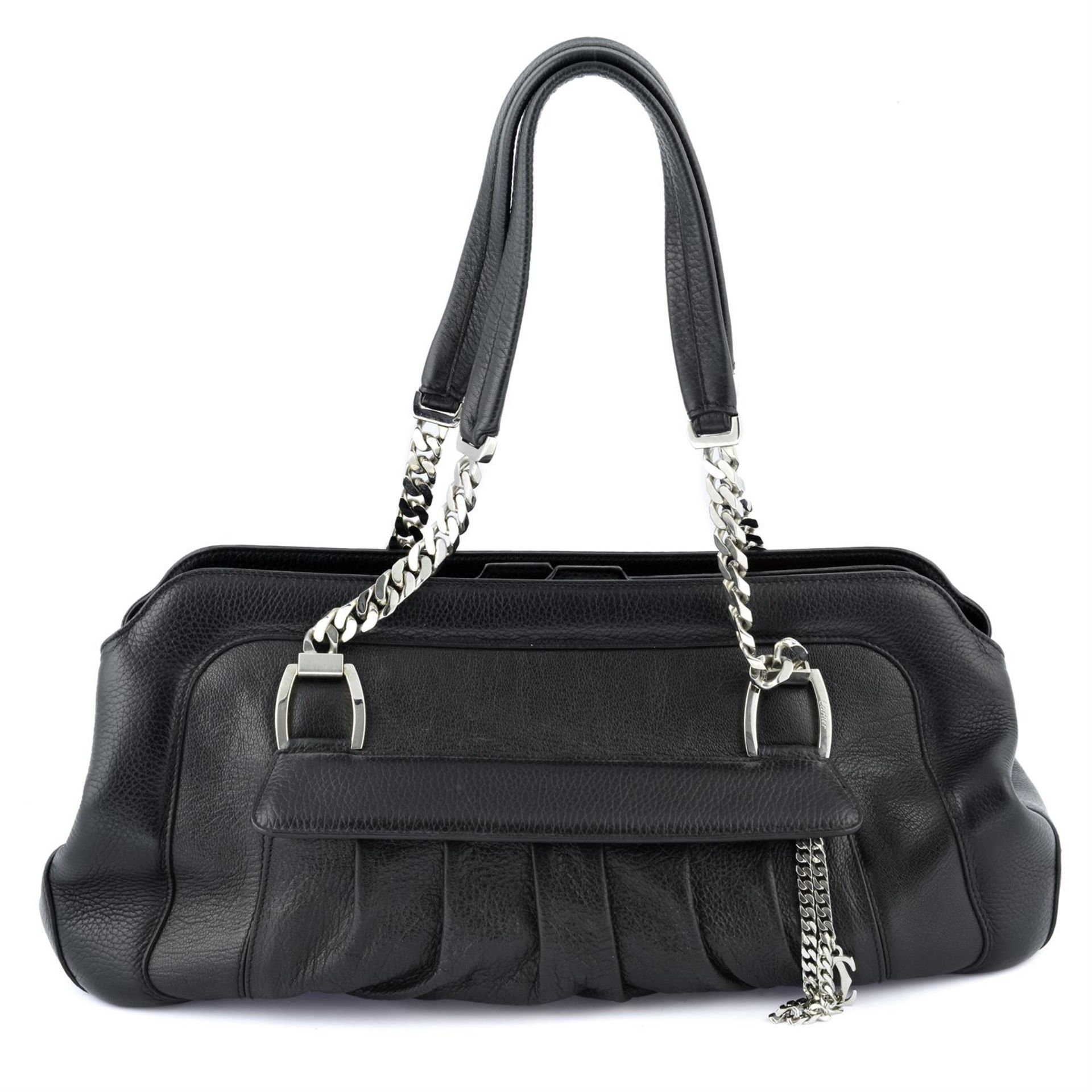 CARTIER - a black leather Multi-Pocket handbag.m
