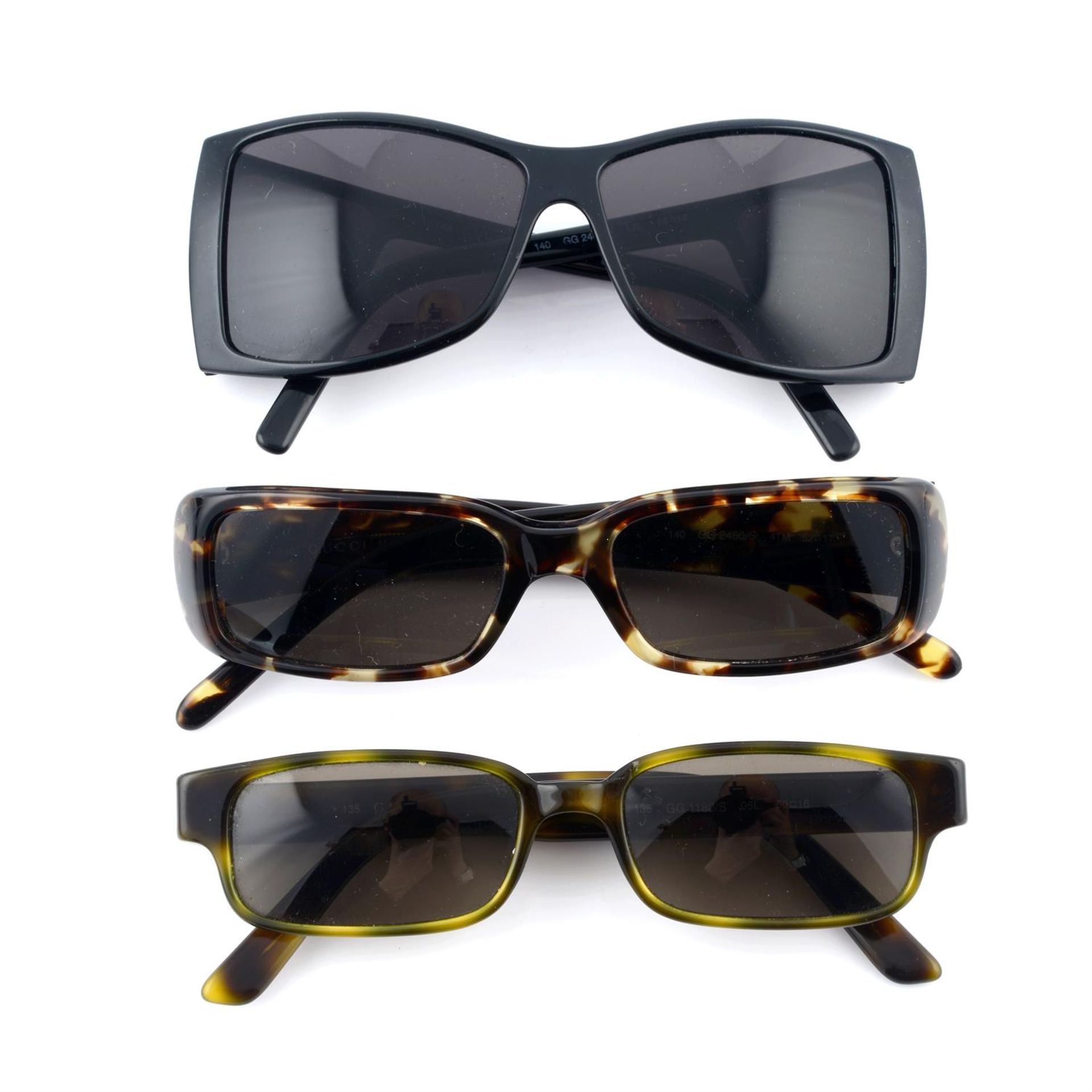 GUCCI- three pairs of sunglasses.