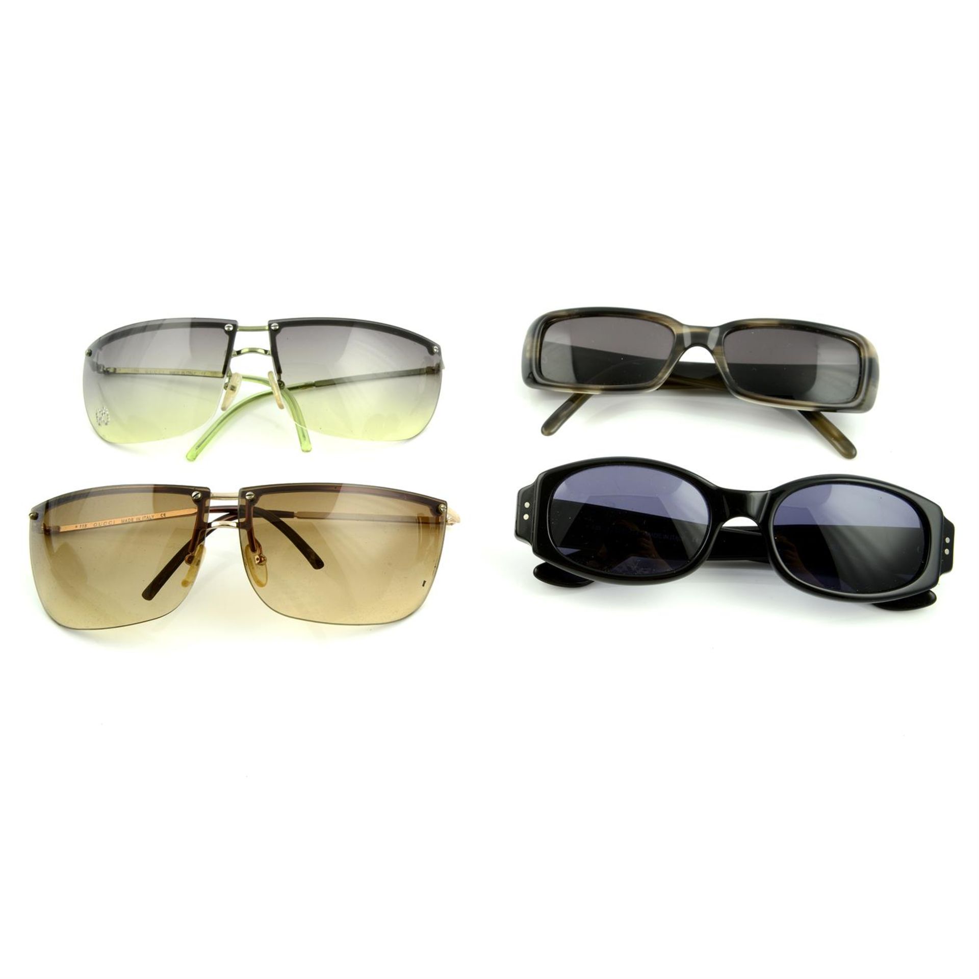 GUCCI - four pairs of sunglasses.