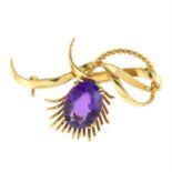 A 1980s amethyst floral brooch.