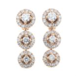 A pair of brilliant-cut diamond cluster drop earrings.