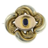 A late 19th century knot brooch, with blue paste highlight.