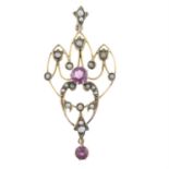 An early 20th century 9ct gold split pearl and garnet pendant.