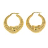 A pair of 9ct gold textured hoop earrings.