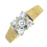 A 1970's 18ct gold diamond cluster ring, with textured sides.