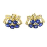 A pair of sapphire and diamond earrings.