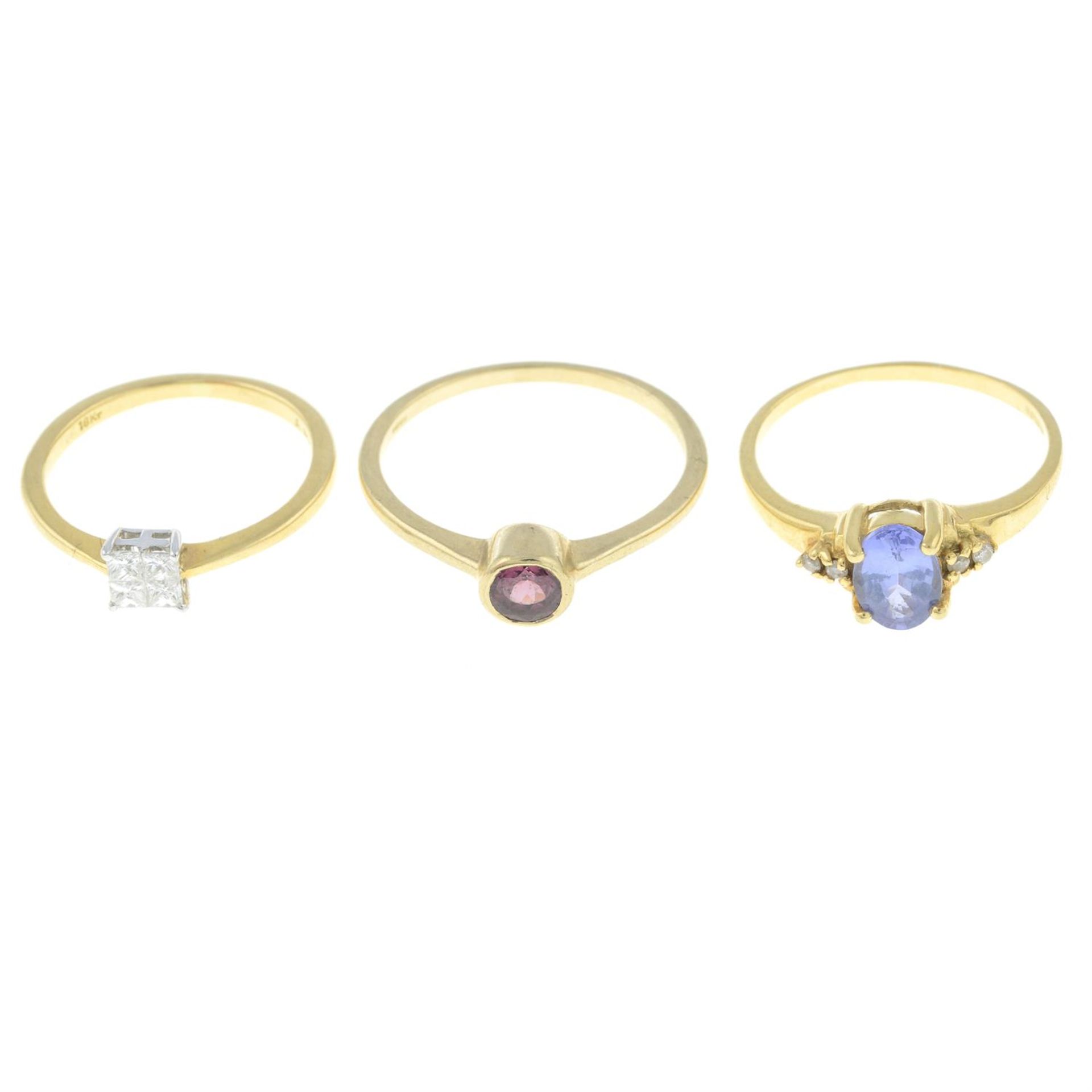 An 18ct gold diamond cluster ring, an 18ct gold tanzanite ring and a 9ct gold garnet ring.