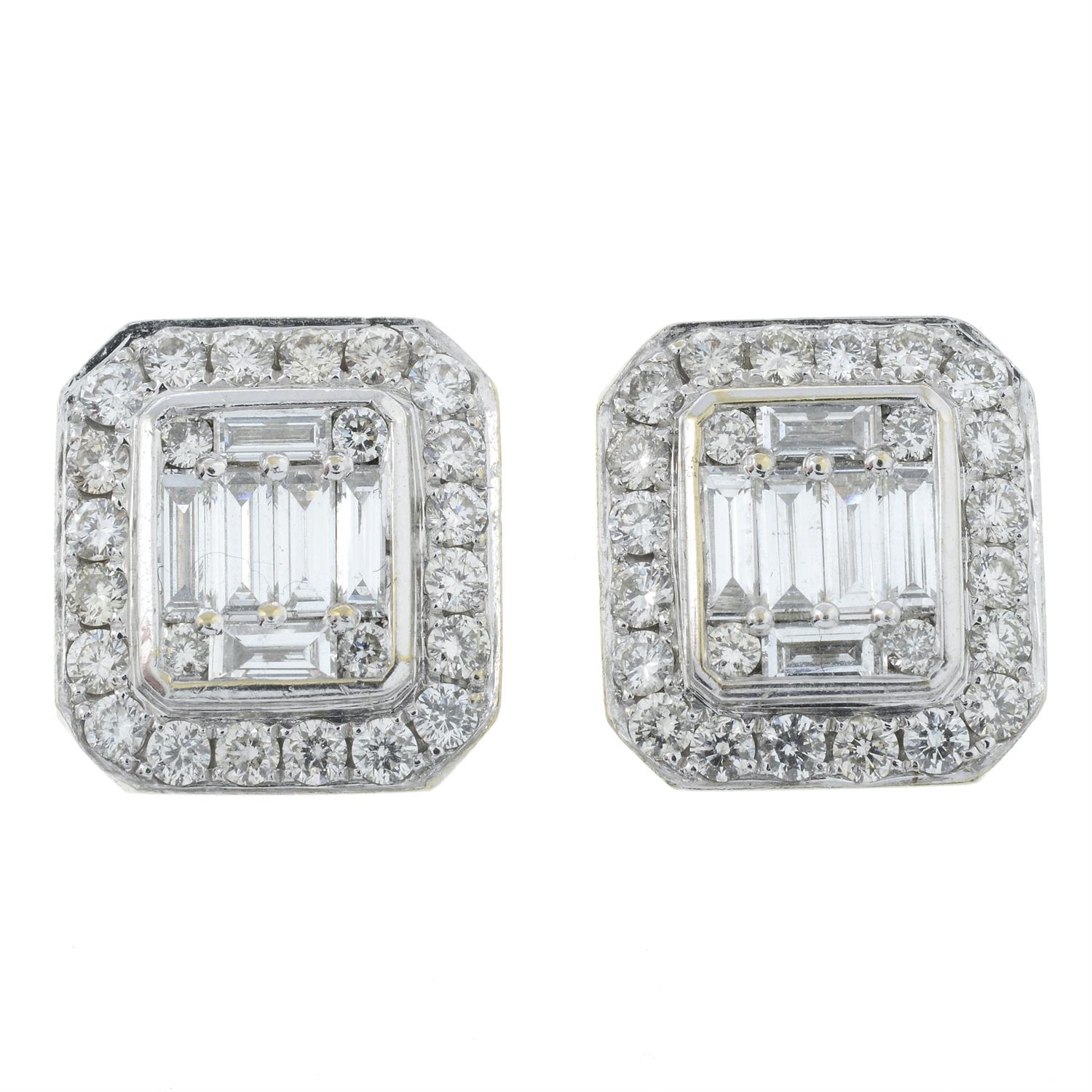 A pair of 18ct gold vari-cut diamond cluster earrings.