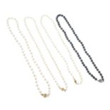 Three cultured pearl single-strand necklaces, together with a 'black' cultured pearl single-strand