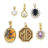 Six mostly gem-set pendants.