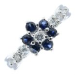 An 18ct gold sapphire and diamond floral cluster ring, with diamond sides.