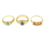 Three gem-set rings.