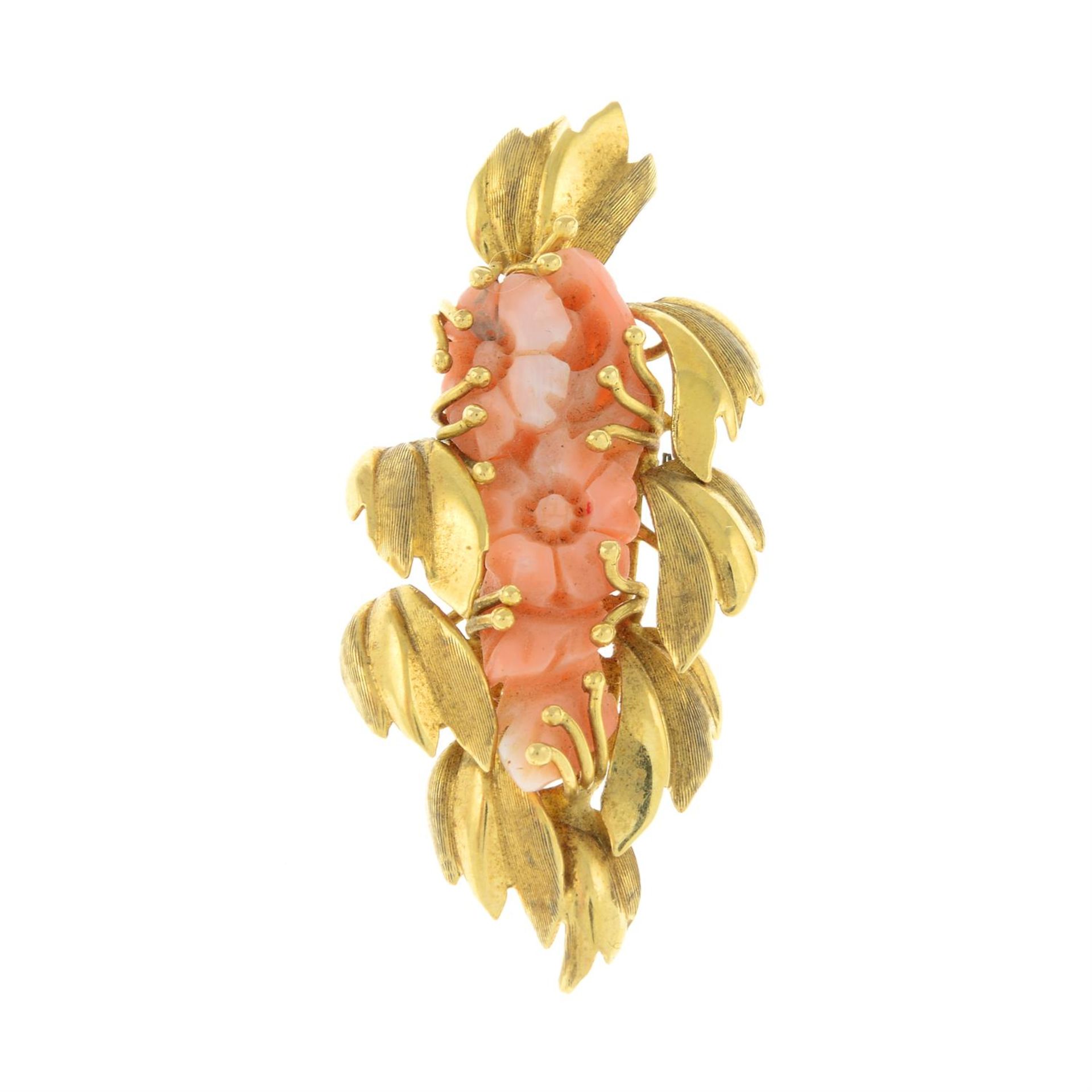 An 18ct gold ornate coral foliate pendant.