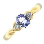 An 18ct gold tanzanite and diamond three-stone ring.