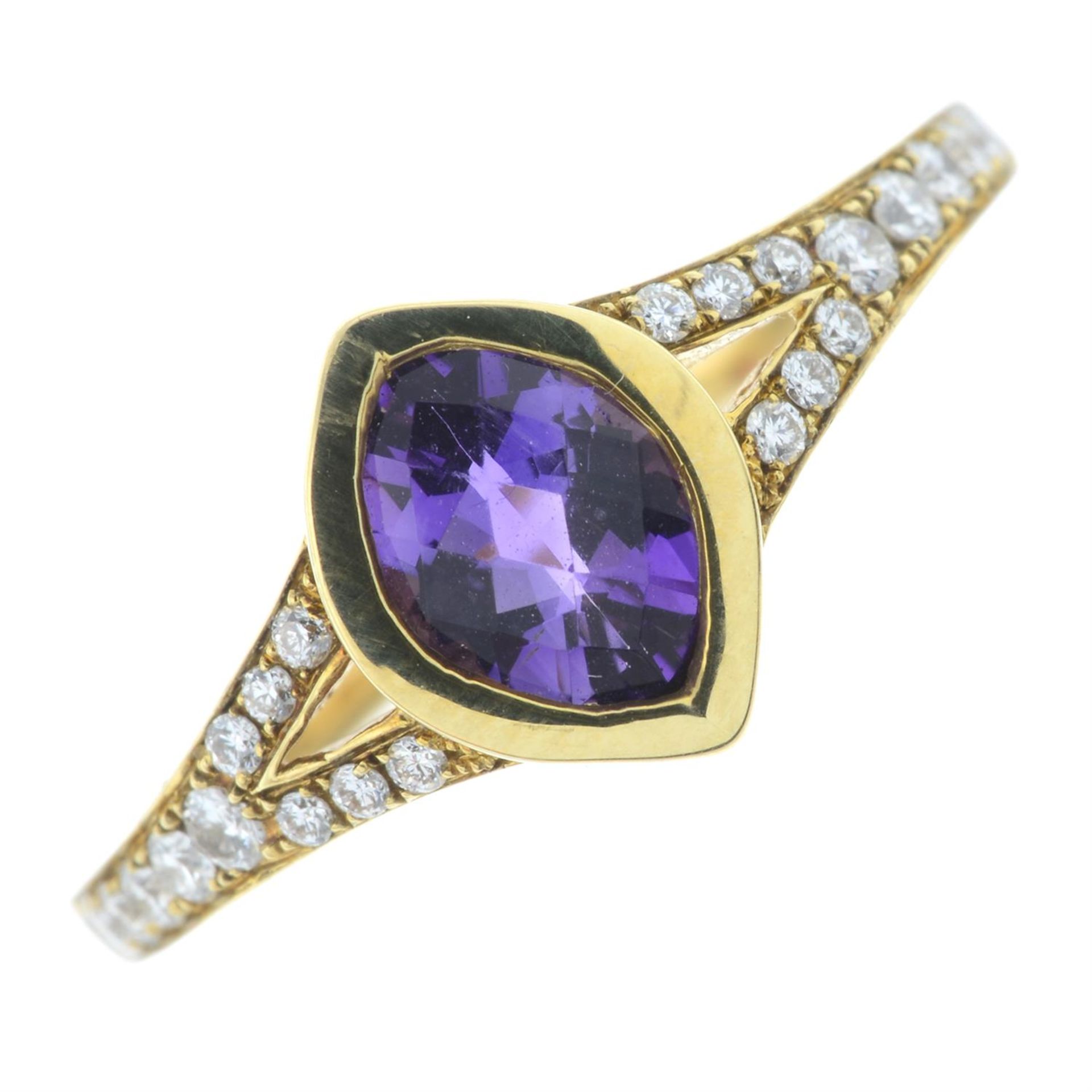 An 18ct gold amethyst dress ring, with diamond sides.