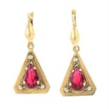 A pair of red paste drop earrings.