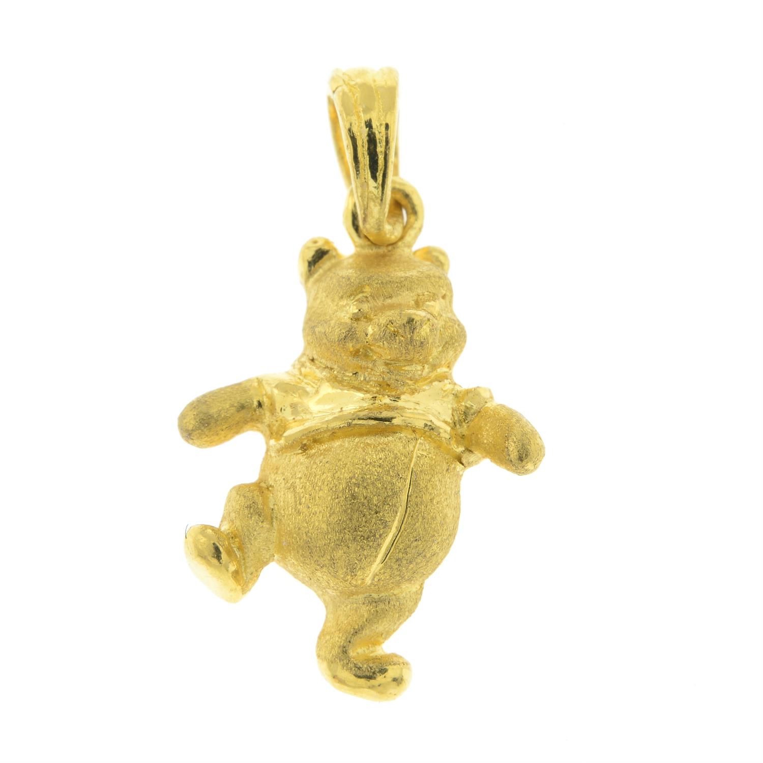 A Winnie the Pooh pendant, by Disney.