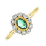 An 18ct gold emerald and brilliant-cut diamond cluster ring.