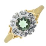 An 18ct gold green tourmaline and diamond cluster ring.