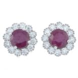 A pair of 18ct gold ruby and diamond cluster earrings.