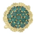 A chrysoprase cluster ring, with textured surround.