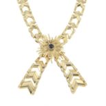 A 9ct gold fancy-link necklace, with sapphire highlight.