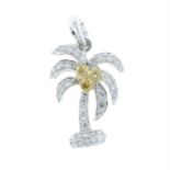 A 'yellow' diamond and diamond palm tree pendant.
