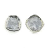 A pair of Polki diamond stud earrings.