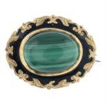 A late 19th century malachite and onyx brooch.