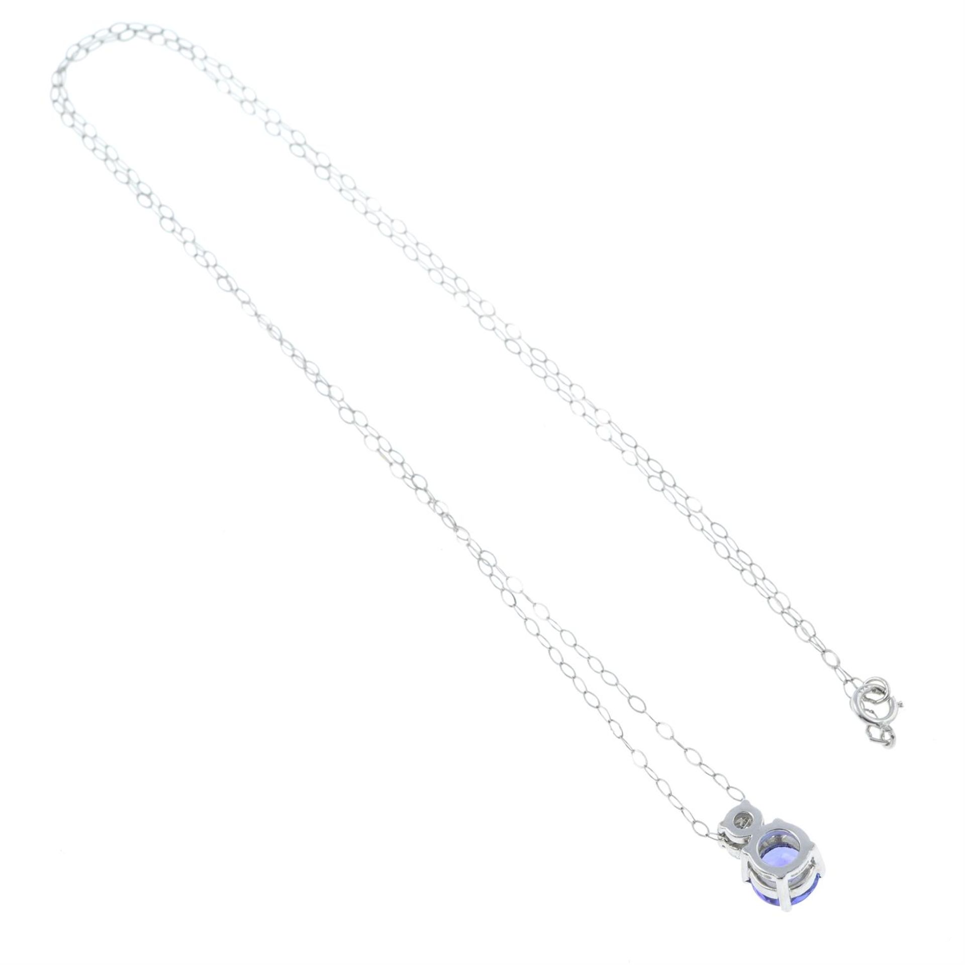 A tanzanite and brilliant-cut diamond pendant with chain. - Image 2 of 2
