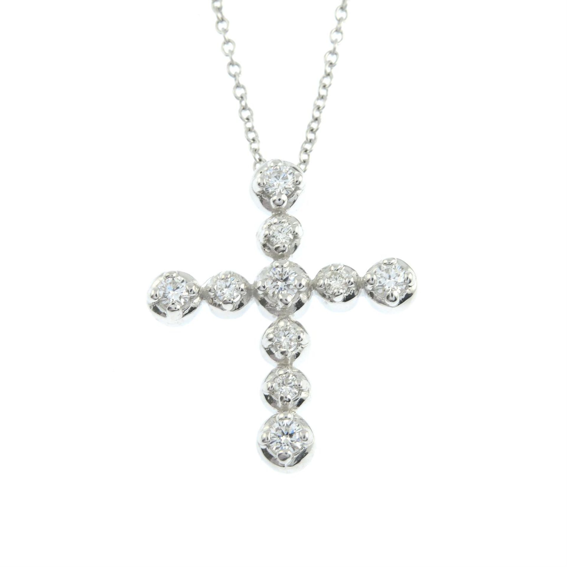 A brilliant-cut diamond cross pendant necklace, by Tiffany & Co.