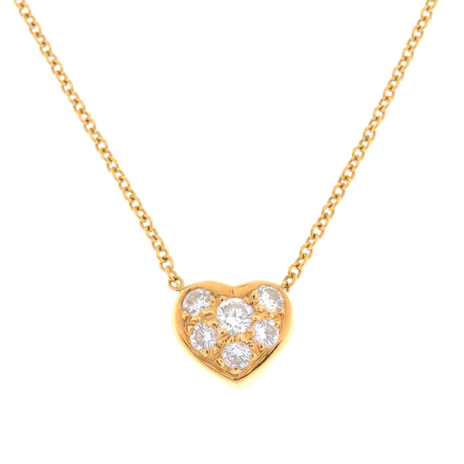 A brilliant-cut diamond heart pendant, on an integral trace-link chain, by Tiffany & Co.