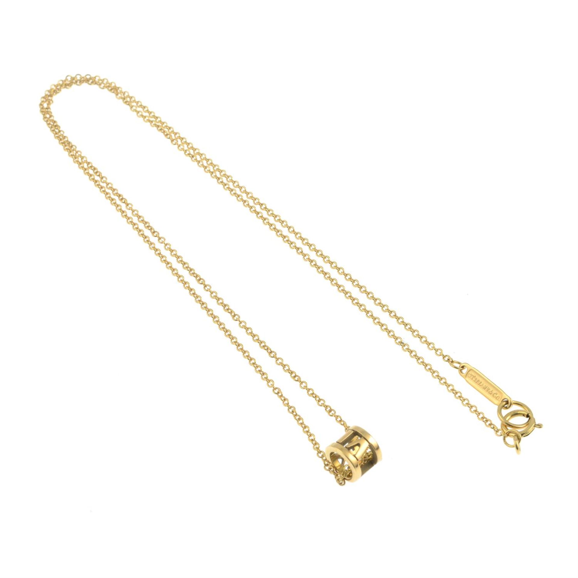 An 'Atlas X Open' pendant, with trace-link chain, by Tiffany & Co. - Image 3 of 3