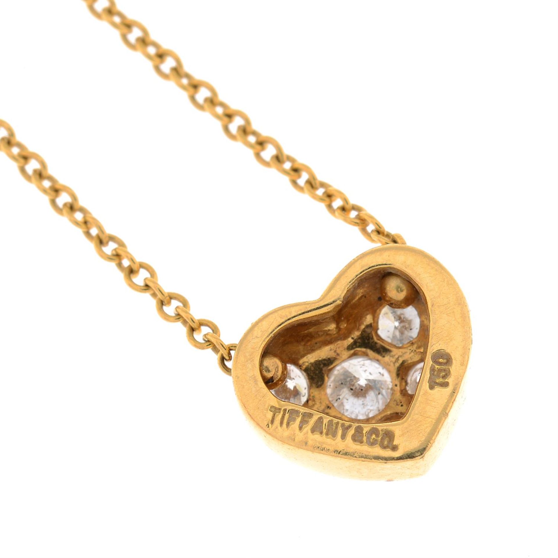 A brilliant-cut diamond heart pendant, on an integral trace-link chain, by Tiffany & Co. - Image 2 of 4