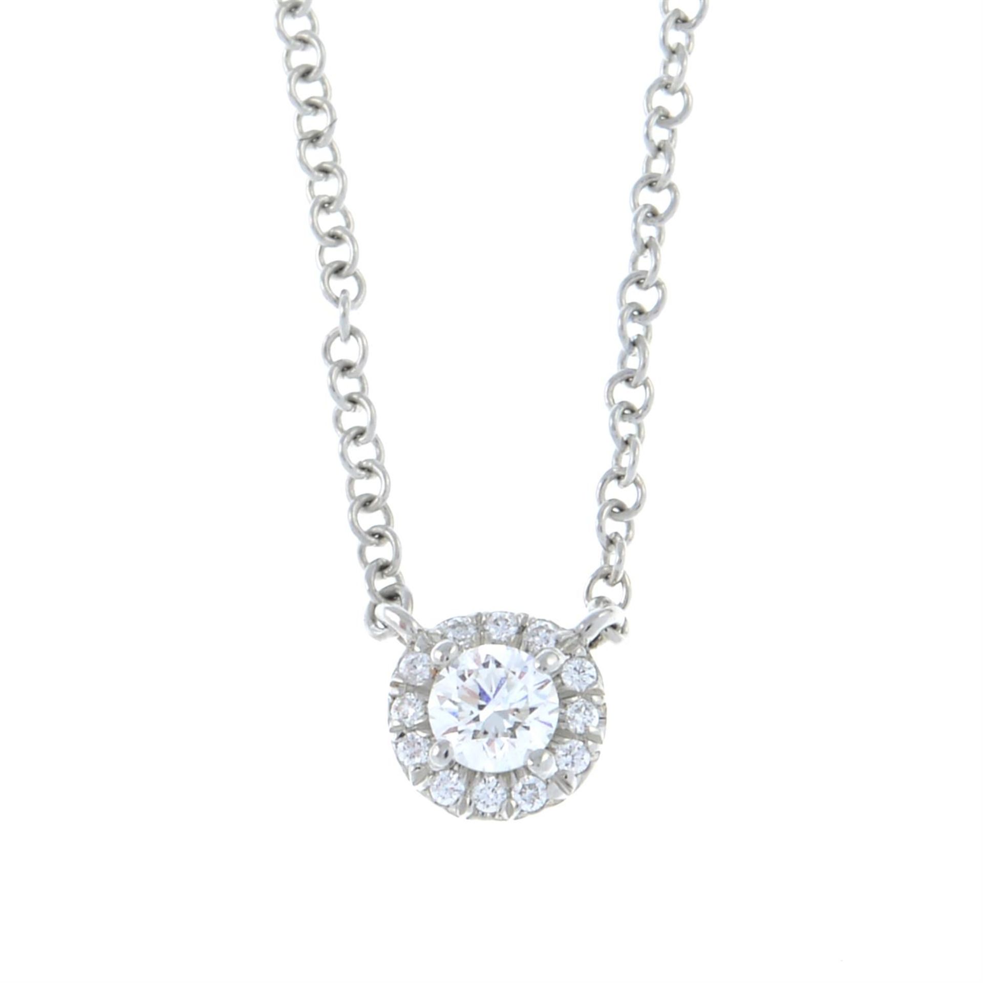 A brilliant-cut diamond cluster pendant, on an integral chain, by Tiffany & Co.