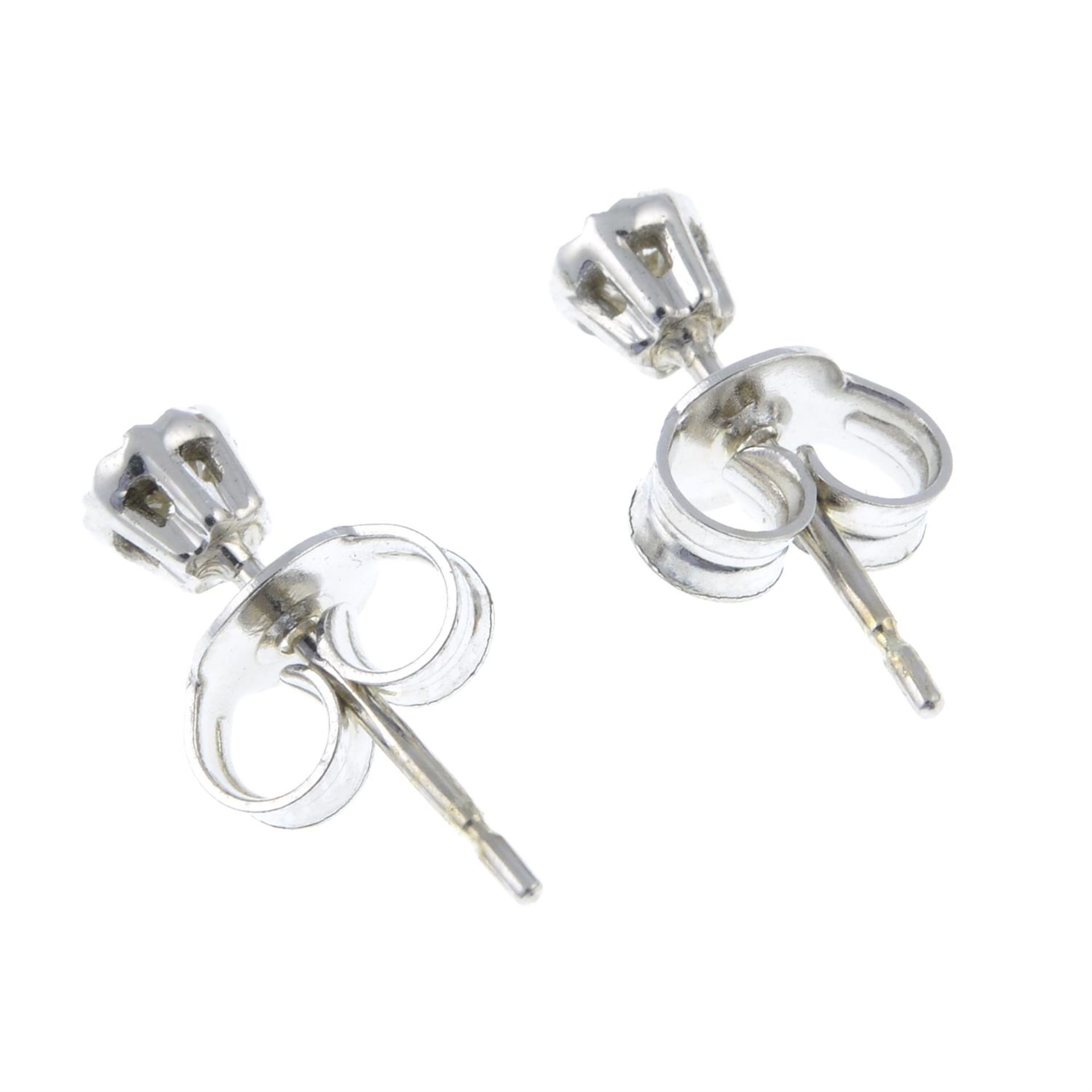 A pair of 9ct white gold illusion-set diamond stud earrings. - Image 2 of 2