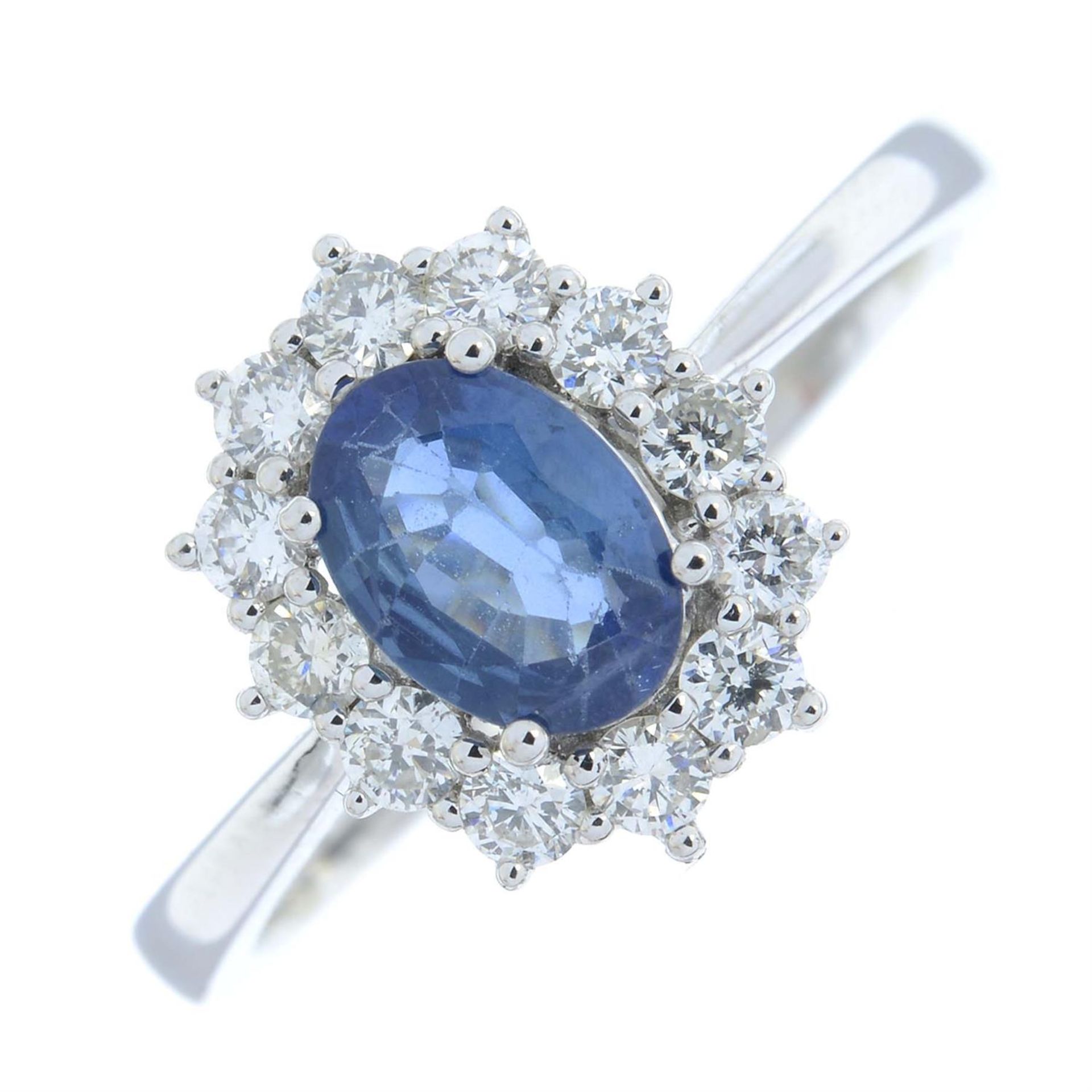 An 18ct gold sapphire and diamond cluster ring.