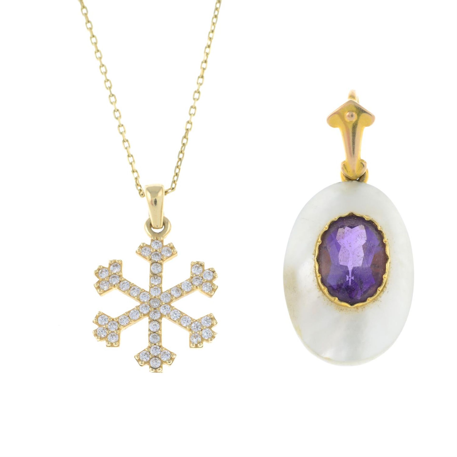 A cubic zirconia snowflake pendant, with chain and an amethyst and mother-of-pearl pendant.