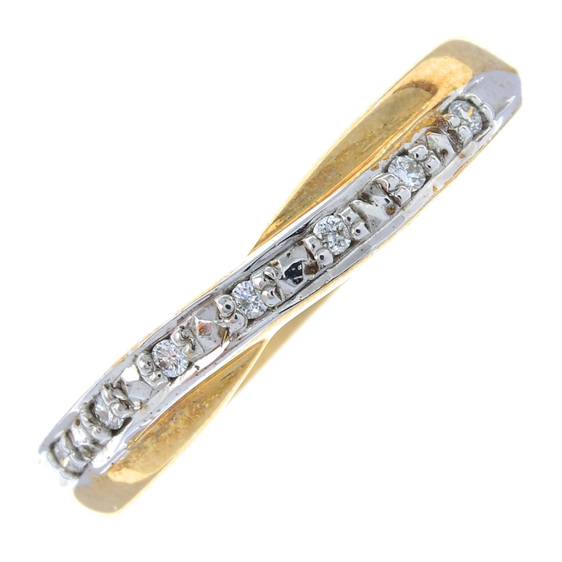 A diamond accent half eternity ring.